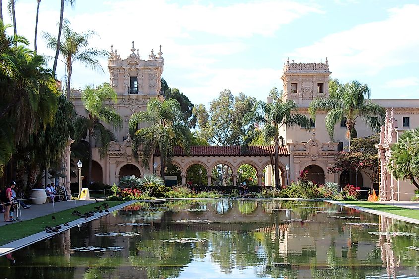 Large pond, with ducks resting off to the side, in front of The House of Hospitality in Balboa Park, San Diego