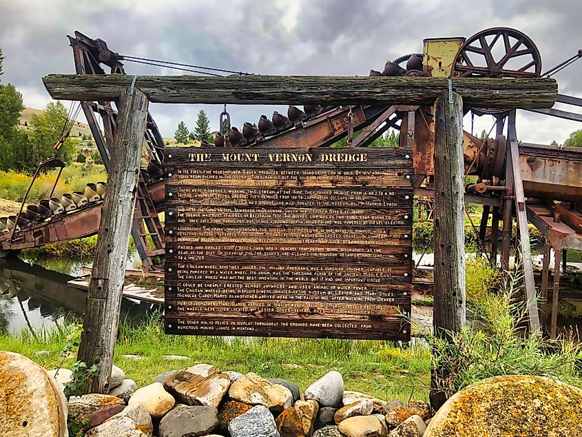 Wooden sign describing the Mount Vernon Dredge near Virginia City, Montana.