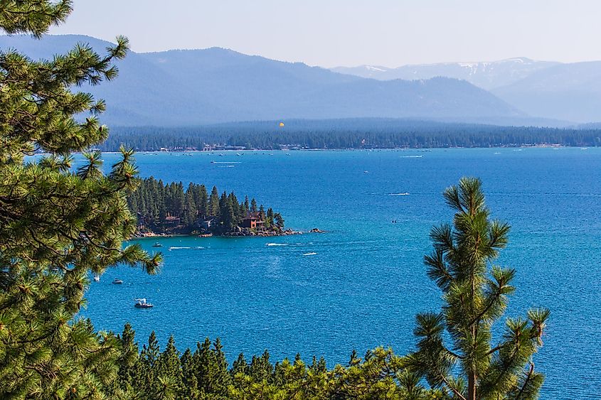 View of Lake Tahoe through pine trees in Zephyr Cove, Nevada.