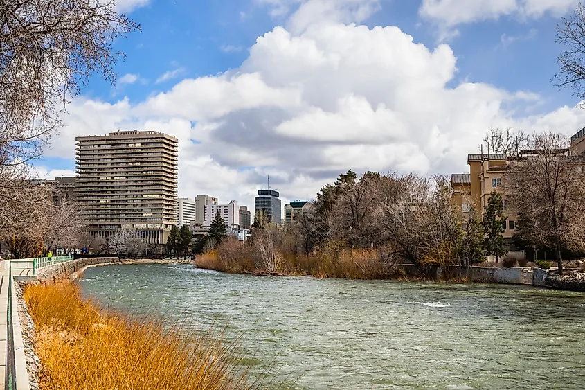 Reno, Nevada, skyline as seen from the shoreline of Truckee River flowing through downtown.