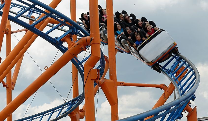 Delaware State Fair participants enjoy a ride on a midway roller coaster.