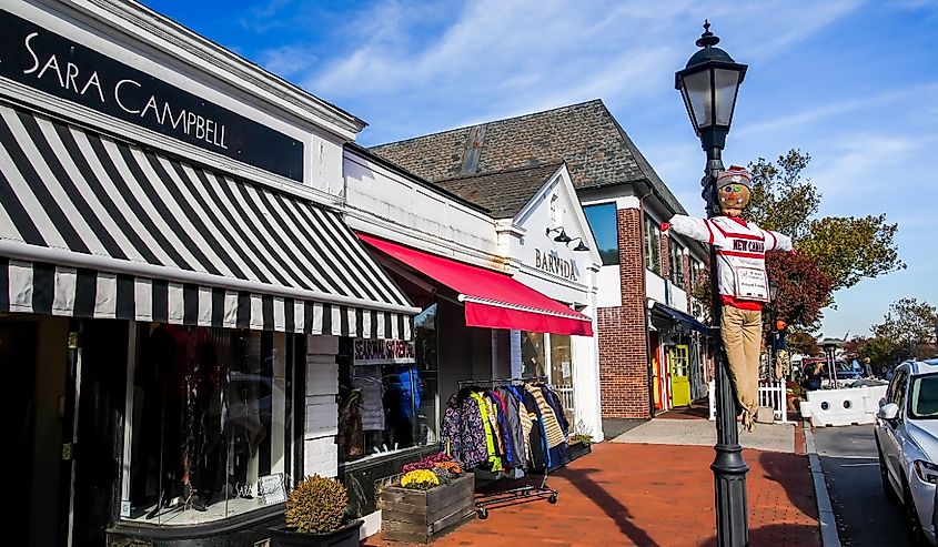 Walkway with store fronts and autumn decoration in nice sunny day in New Canaan, Connecticut.