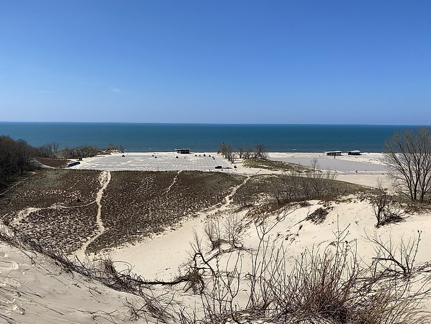Empty beach parking lots as seen from the dunes above. A bluebird spring day