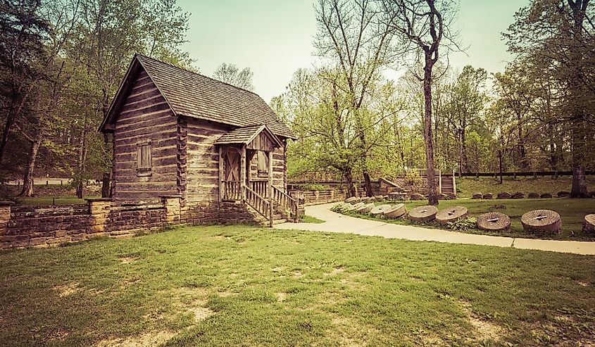 McHargue's Mill at Levi Jackson State Park with trees in green grass