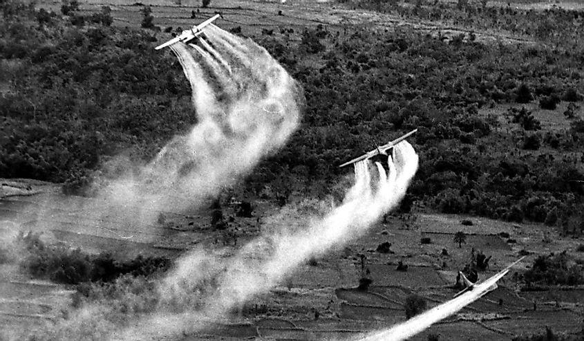 Vietnam War, Crop duster airplanes spray Vietnamese countryside with napalm
