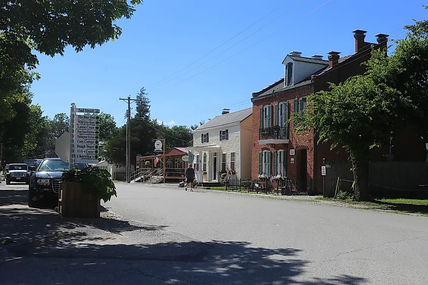 Kimmswick, Missouri: Street view of 2nd Street featuring historic buildings and signs to various attractions.