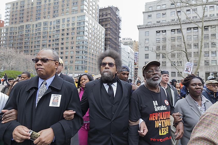 Carl Dix (3rd from L) and Cornel West( 2nd from L) walk with protesters against police brutality. Editorial credit: lev radin / Shutterstock.com