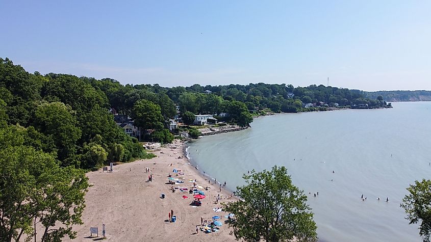 An aerial view of people vacationing on the sandy beach by Lake Erie in Port Stanley, Ontario, Canada