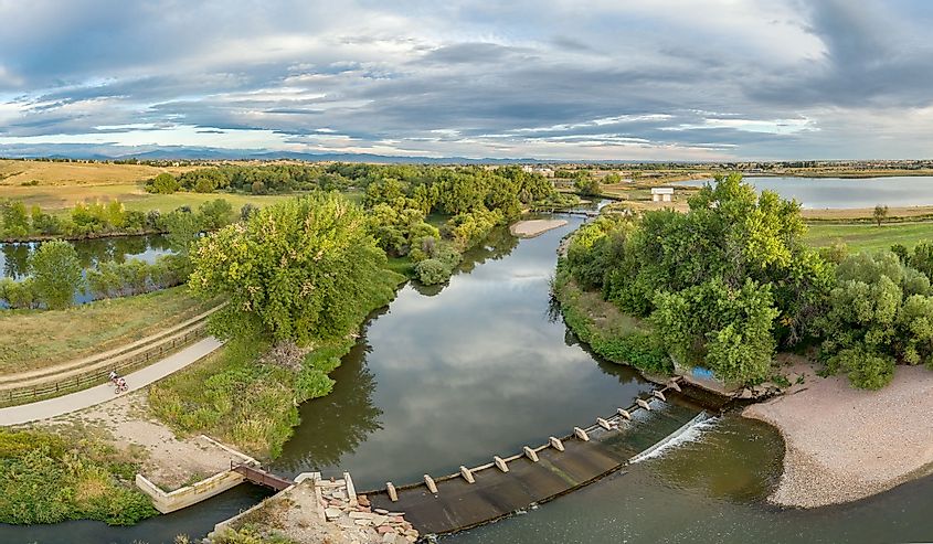 aerial panorama of the Cache la Poudre River with diversion dams and bike trail 