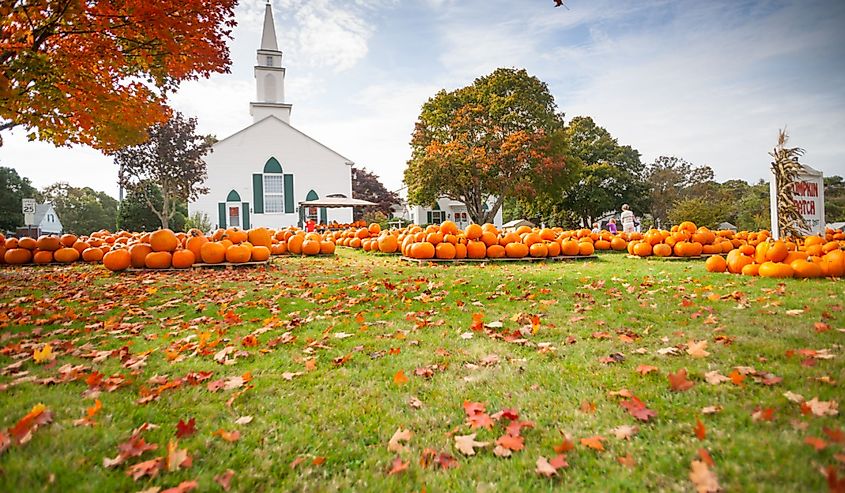 Pumpkin Patch pumpkin sale outside traditional church in Cooper Parish New England, West Yarmouth.