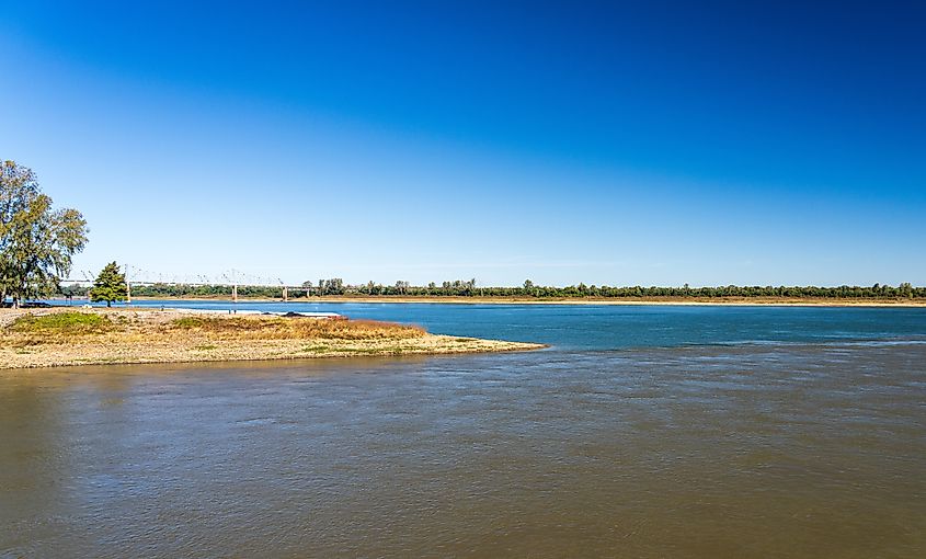 Confluence of the blue Ohio river and brown Mississippi river at Cairo, Illinois with blue and brown muddy streams starting to mix