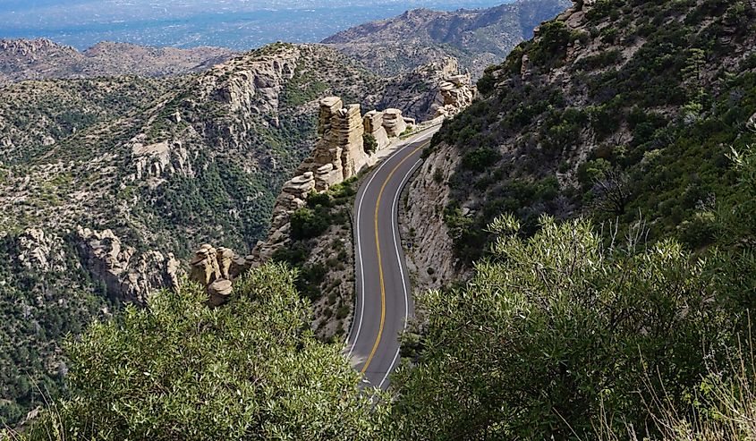 Dramatic overhead view of the scenic Santa Catalina Mountains landscape, Tucson, Arizona USA, with curving road to Mt. Lemmon and rugged, sculptural rock formations, no cars.