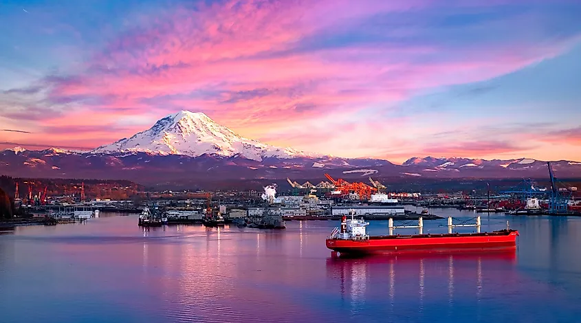 Ships and cranes at the Port of Tacoma with Mount Rainier behind