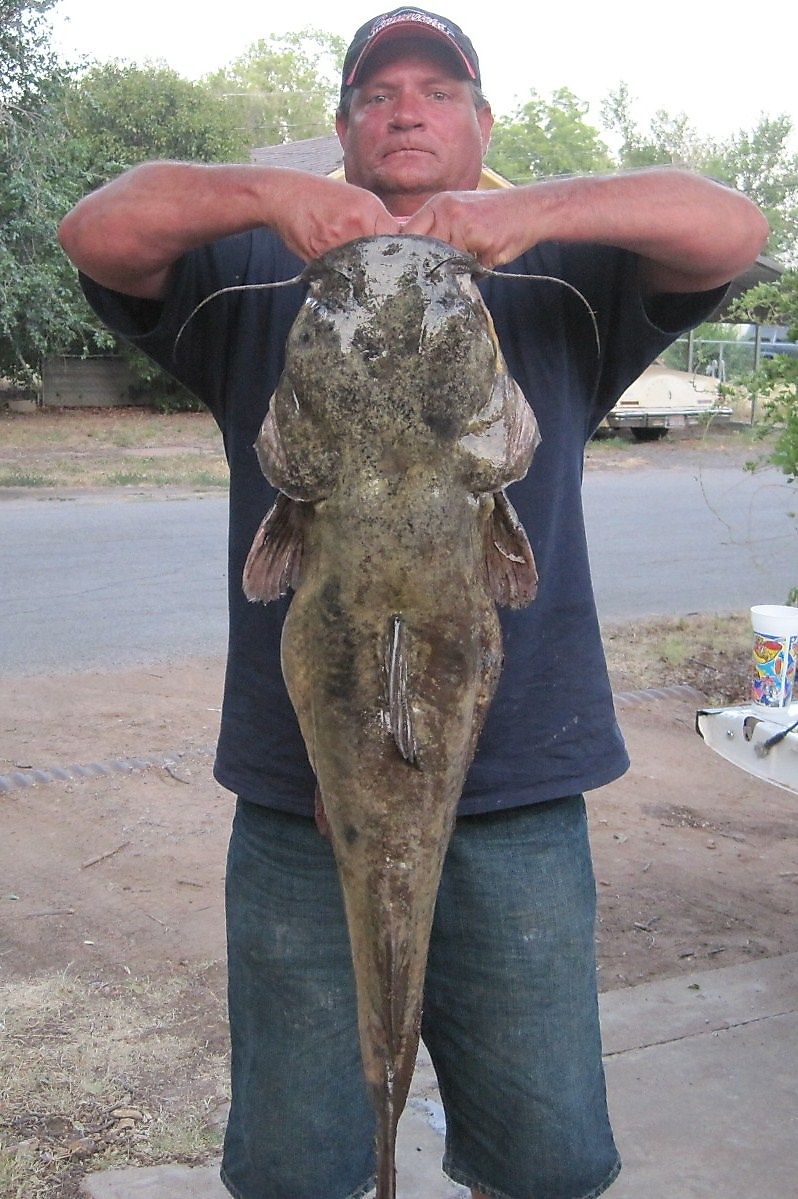 A participant in the Okie Noodling Tournament with his catch