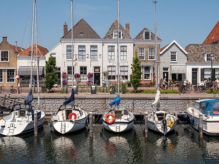 Waterfront homes and boats along the harbour in Brouweshaven, Netherlands.