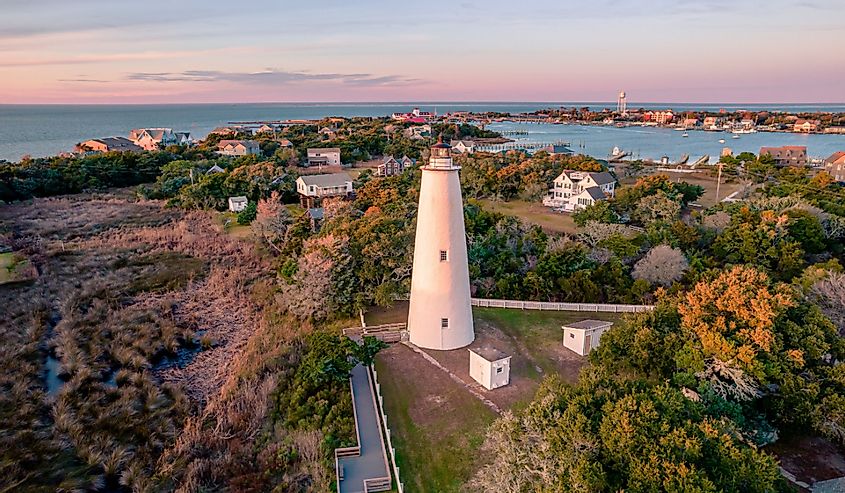 Ocracoke Lighthouse in Ocracoke, North Carolina at sunset.The lighthouse was built to help guide ships through Ocracoke Inlet into Pamlico Sound.