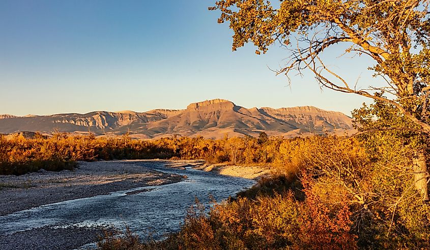 The Teton River with Ear Mountain in autumn at sunrise near Choteau, Montana.