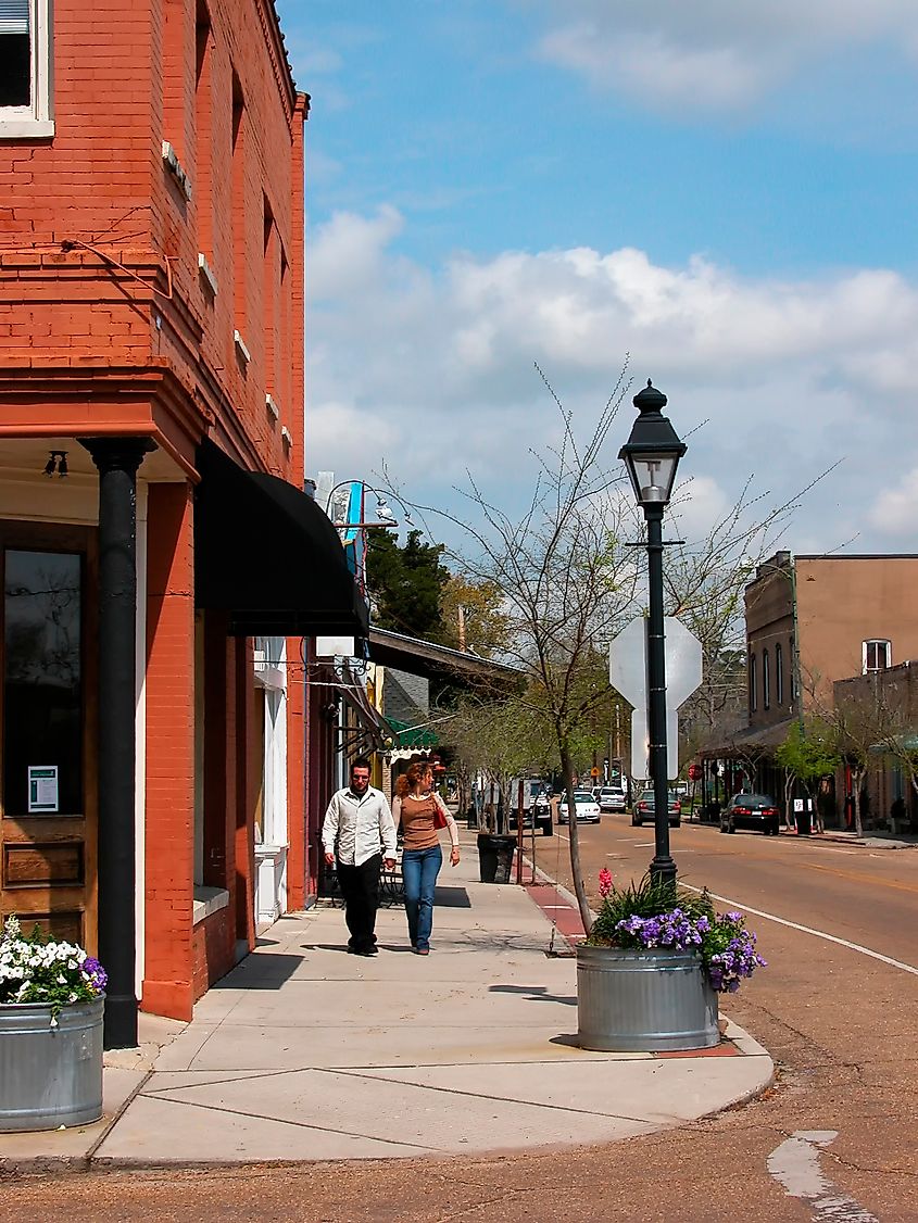 Covington, Louisiana, USA, couple strolling on Columbia Street.