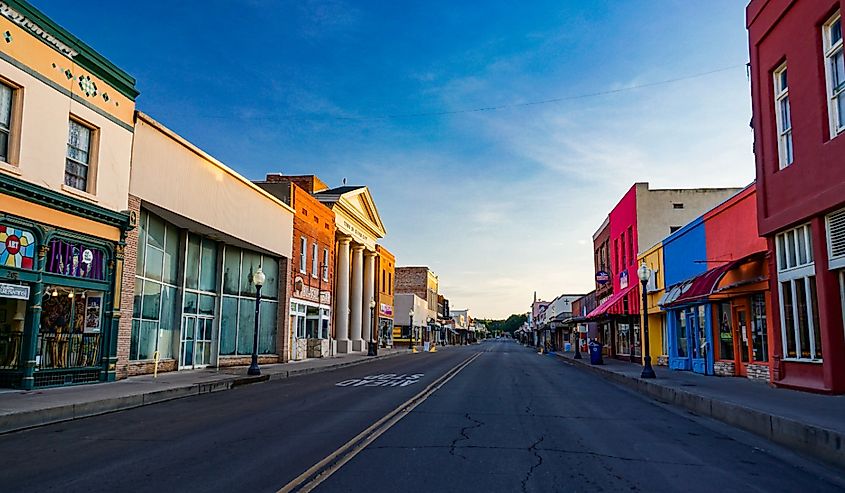 Bullard Street in downtown Silver City, looking north early on a summer morning. A historic southwestern mining town with shops, stores and restaurants.