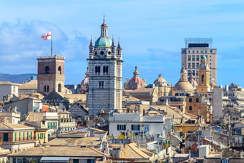 The historic medieval center of Genoa - San Lorenzo Cathedral and a flag of Genoa