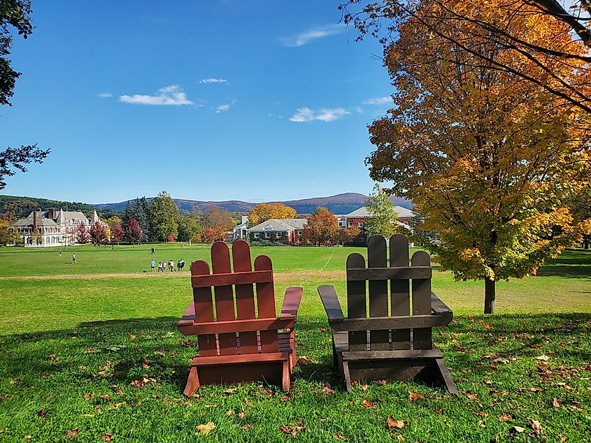 Two chairs overlooking a scene of Vermont foliage at Middlebury College.