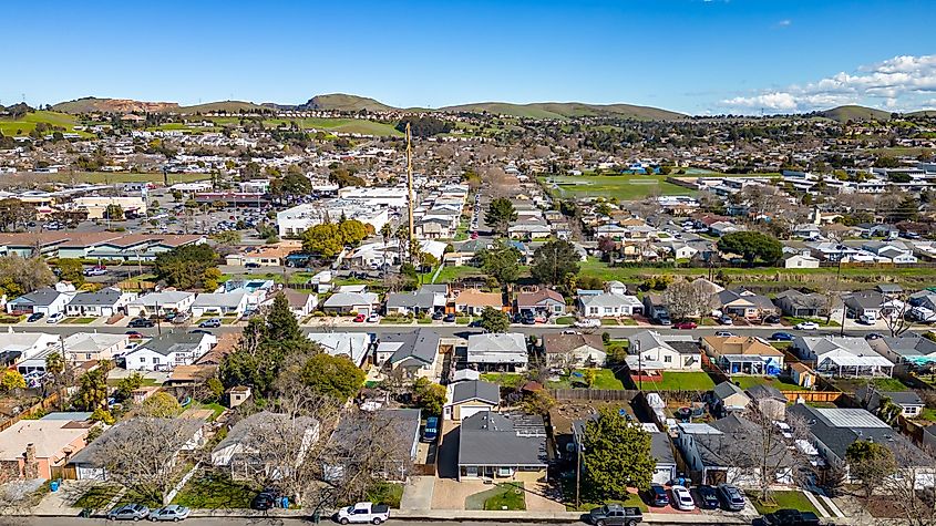 Aerial Photos over a community in Vallejo, California with houses, streets, cars and parks
