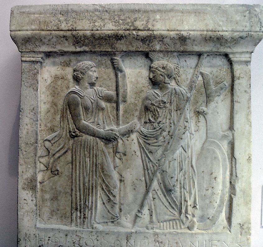 The relief depicts Hera and Athena, patron-deities of Samos and Athens handshaking. 