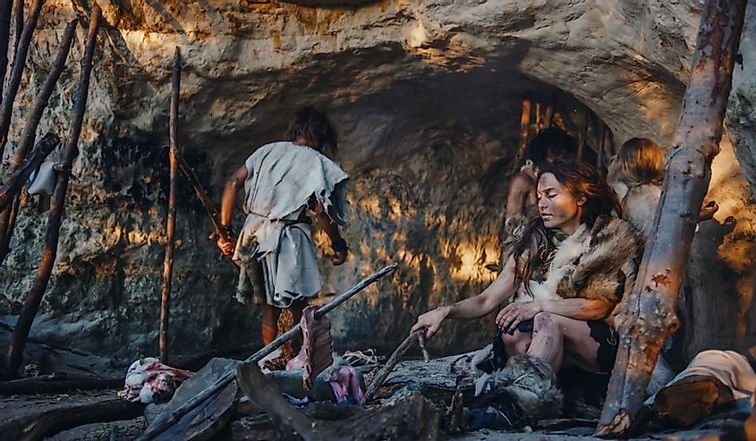 Tribe of Hunter-Gatherers Wearing Animal Skin Live in a Cave.