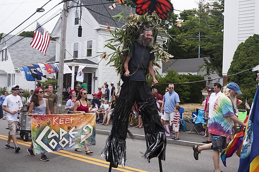 Man walking on stilts in the Wellfleet 4th of July Parade in Wellfleet, Massachusetts.