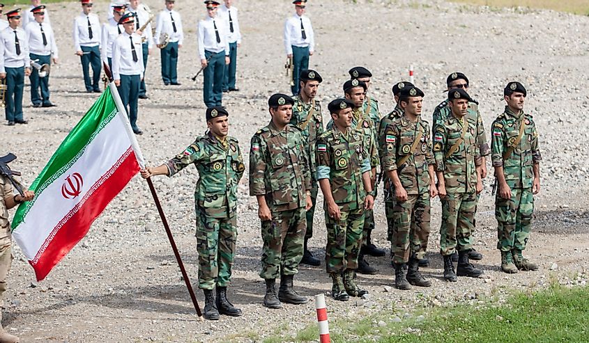 platoon of soldiers of the Iranian army with the flag of the Islamic Republic of Iran