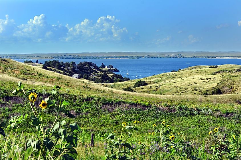Rolling Nebraska grassland sloping down to Lake McConaughy