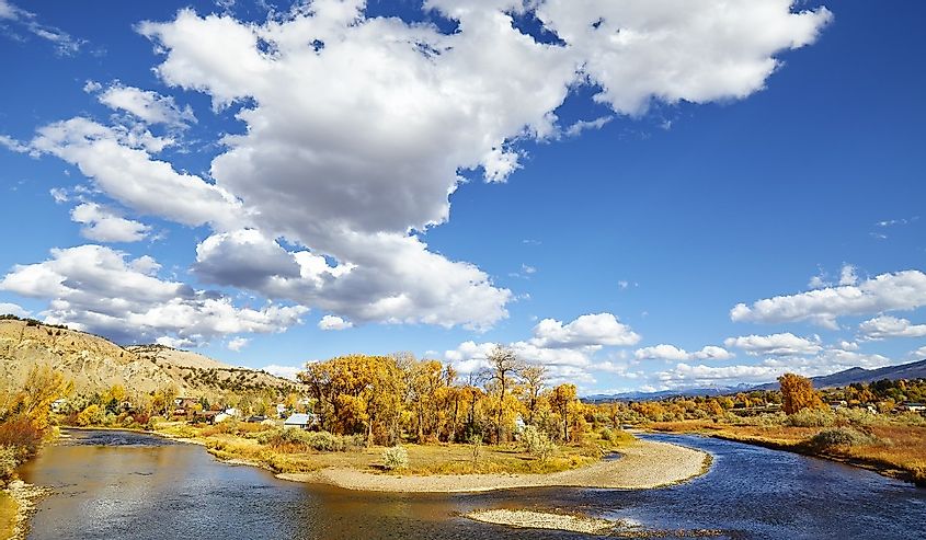 Beautiful autumn landscape, yellow leaves and blue sky with the Eagle River, Colorado