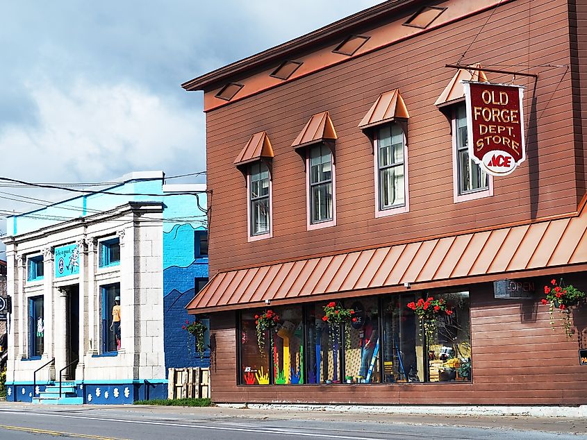Shops and businesses along Route 28 in the picturesque Adirondack town of Old Forge , New York during the summer season.