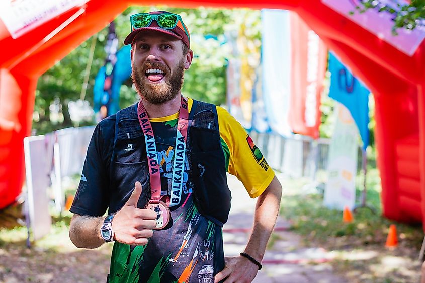 Author, Andrew Douglas giving a thumbs up at the finish line of the Balkaniada Sky Race, in Karlovo, Bulgaria.