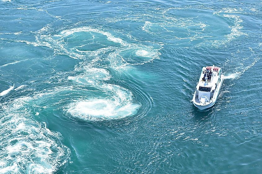 The world largest whirlpools in Naruto Channel and a sightseeing boat.