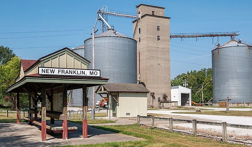 Katy trail head converted railway stop, with agricultural facilities in background in New Franklin, Missouri.
