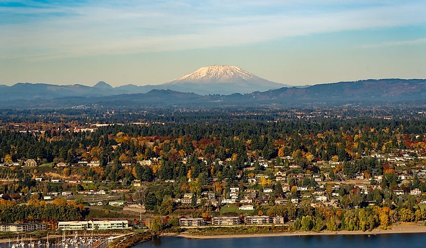 Mt Saint Helens, the columbia river, a boat mooring facility and fall color trees in Vancouver, Washington.