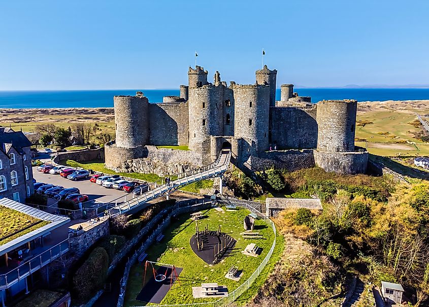 An aerial view towards Harlech Castle and surrounding grounds, Harlech, Wales in springtime.