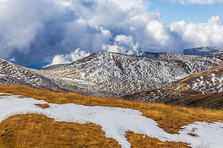 Patches of snow building up on slopes of Snowy Mountains at Mount Kosciuszko National Park, Australia