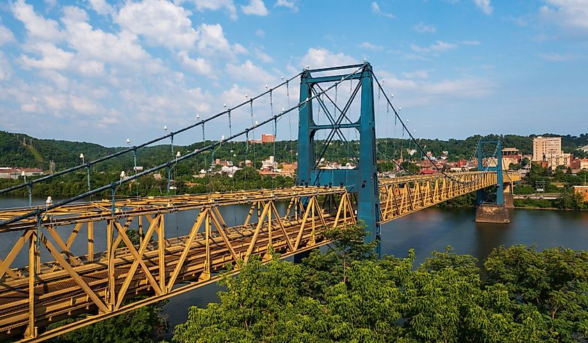 This is an afternoon view of the historic Market Street Bridge, a wire suspension and Warren through truss over the Ohio River between Weirton, West Virginia and Steubenville, Ohio.