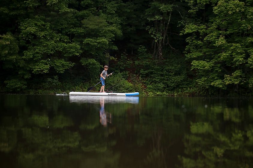 A child paddle boarding in Guilford, Vermont.