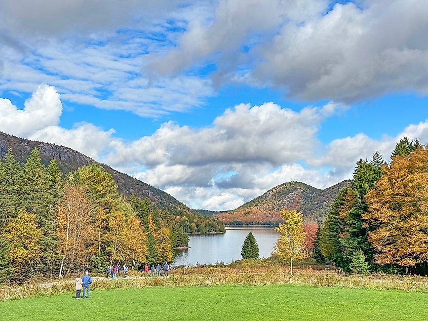 Visitors admire the beauty of the Jordan Pond and its surrounding landscape in the Acadia National Park, Maine.