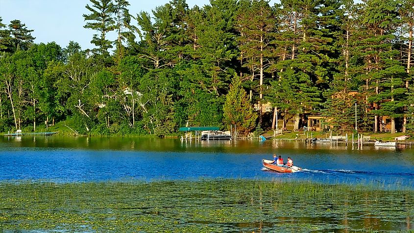 Fishing boat on calm lake near resort on a beautiful evening in Bemidji in northern Minnesota