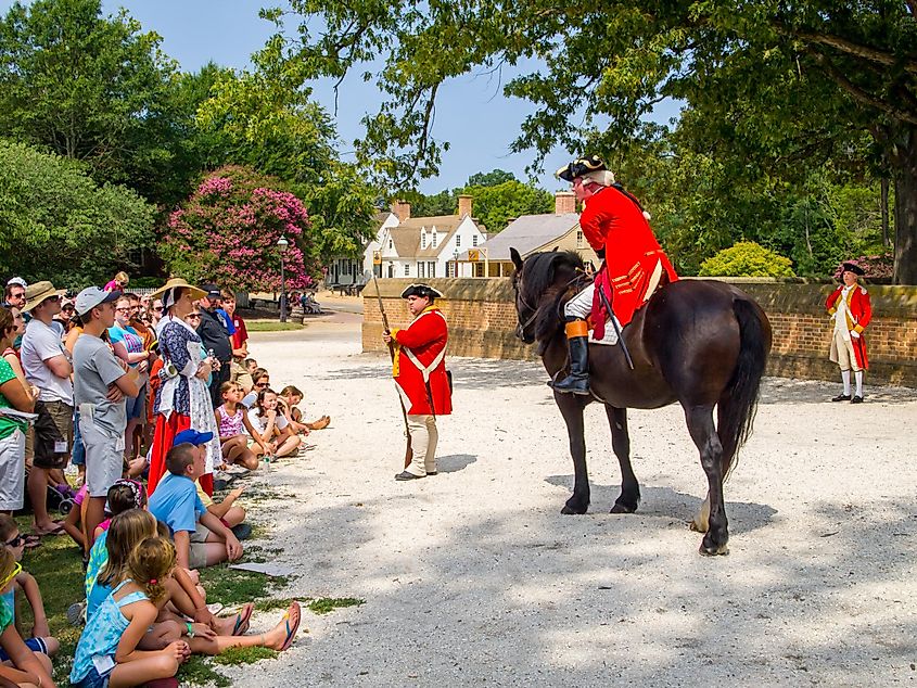 An actor playing Benedict Arnold, with crowd in attendance, at Colonial Williamsburg in Virginia.