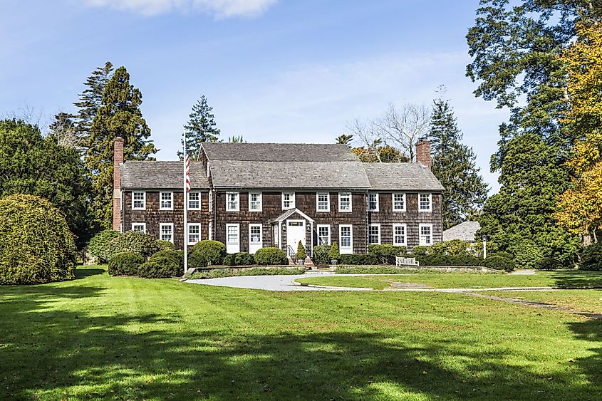 Old Victorian building and a public park in East Hampton on a sunny day.