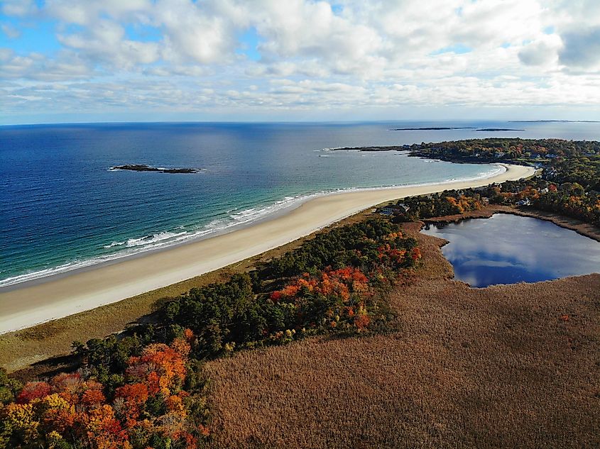 Aerial view of colorful autumn foliage over the Scarborough Beach State Park in Maine