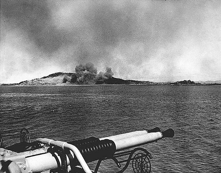 U.S. Navy ships bombard the Korean coast in preparation for the September 1950 amphibious landing at Inchon during the Korean War initiated by Kim Il-sung's invasion of South Korea.
