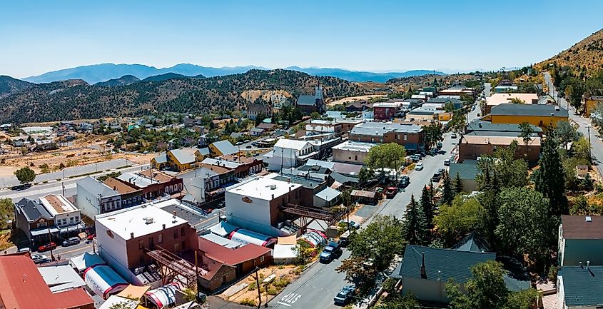 Aerial view of Main C Street in downtown Virginia City, Nevada, showcasing the historic street lined with cars and featuring a blend of unique buildings.