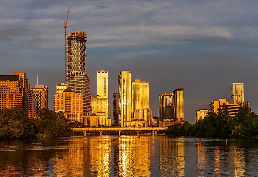 Tallest building in Texas over Lady Bird Lake in the city skyline of Austin TX.