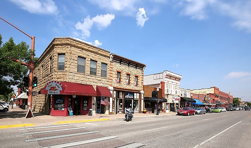 Downtown street in Cody, founded in 1896 by Colonel William F. “Buffalo Bill” Cody, designed with wide streets so his wagons could turn around, via Jillian Cain Photography / Shutterstock.com